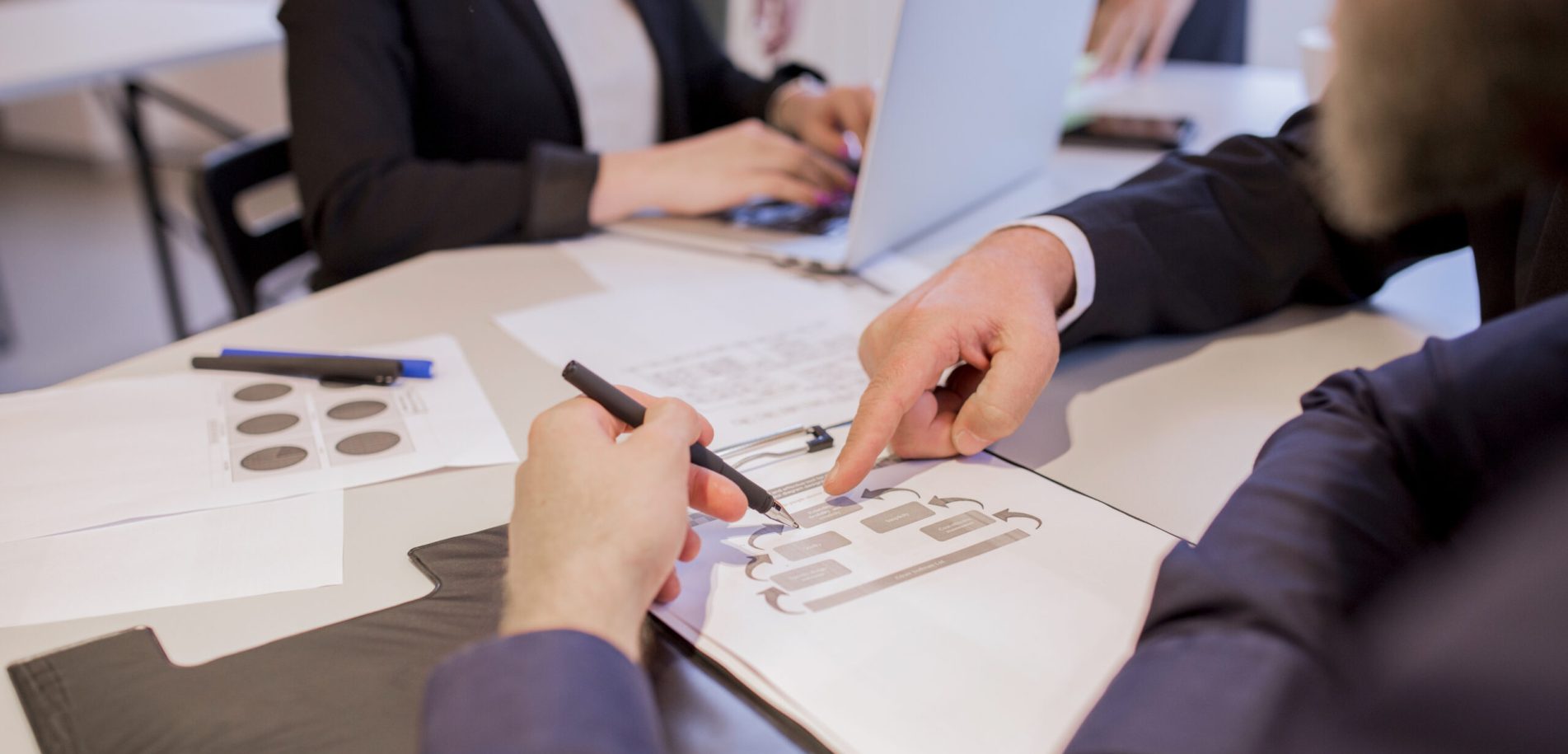 close-up-businesspeople-hands-discussion-business-plan