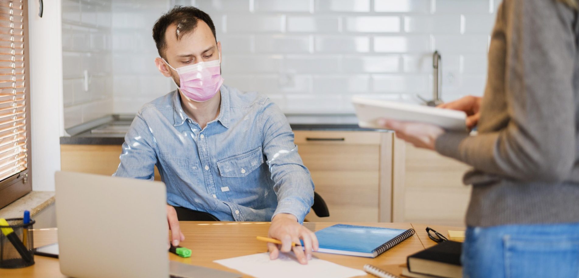 male-student-getting-tutored-home